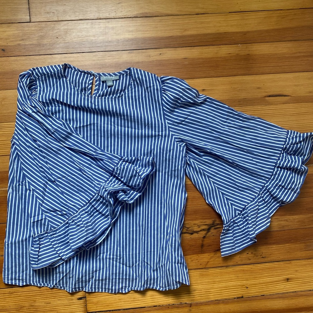 Blue and white striped top. Great for work or can dress down for every day wear